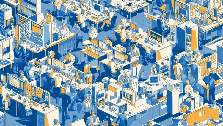 Crowded office with employees working at desks and computers.